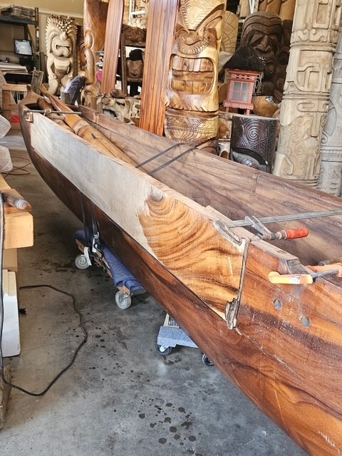Wooden outrigger canoe